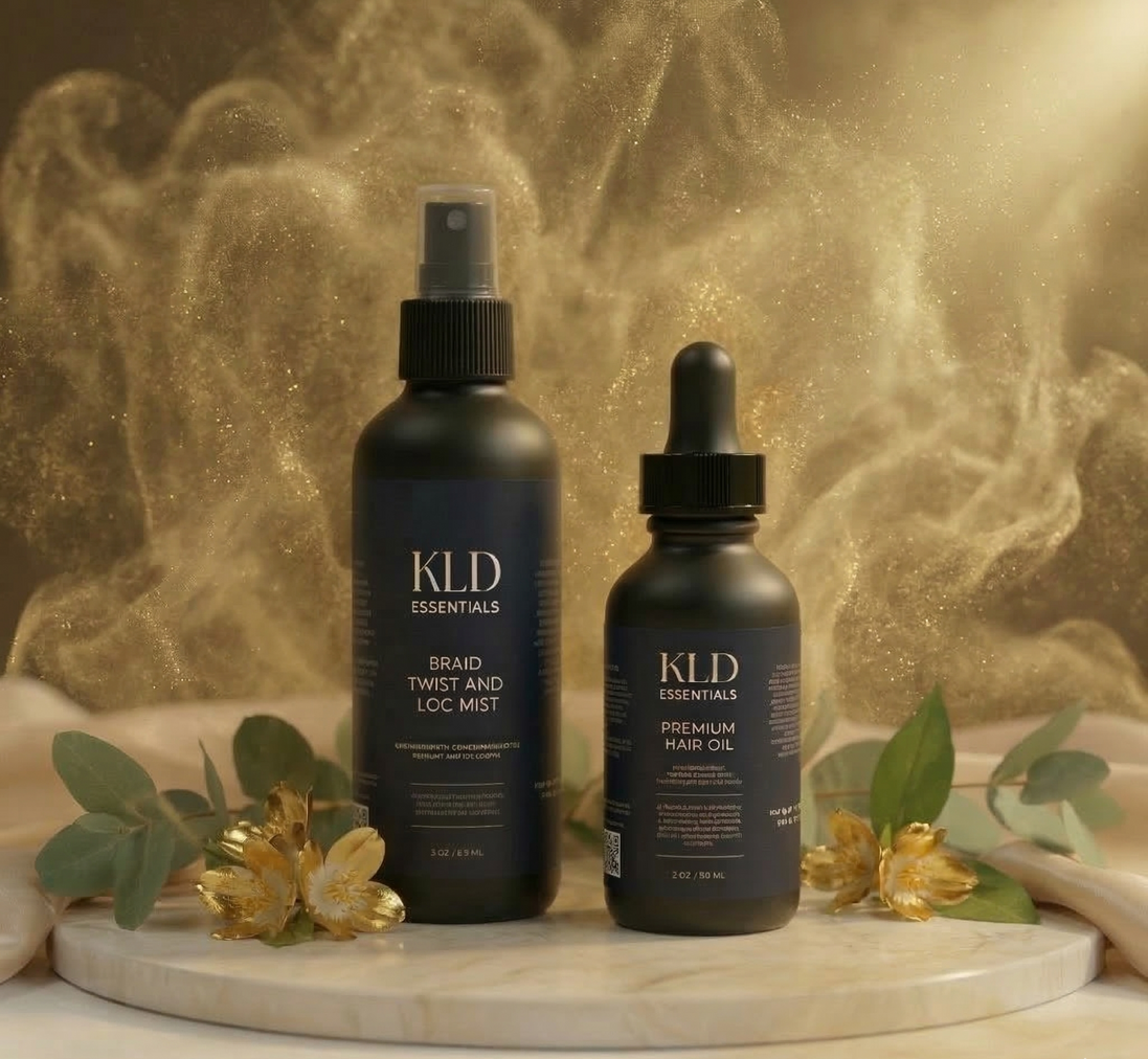 Two KLD hair care products on a marble surface with a gold leaf background